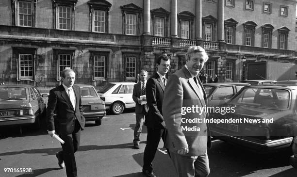 Dr Garret Fitzgerald leaving Leinster House after his resignation as the leader of Fine Gael, . .