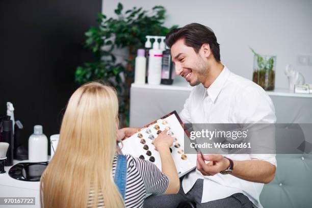 woman choosing hair color from palette in hair salon - color palette bildbanksfoton och bilder