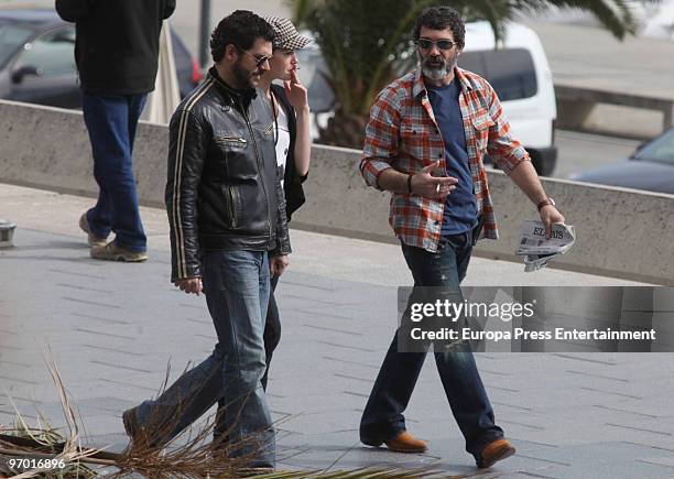 Antonio Banderas goes for a walk with the actess Maria Ruiz and an unknown person on February 24, 2010 in Barcelona, Spain.