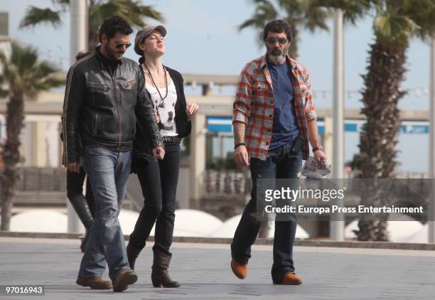 Antonio Banderas goes for a walk with the actess Maria Ruiz and an unknown person on February 24, 2010 in Barcelona, Spain.