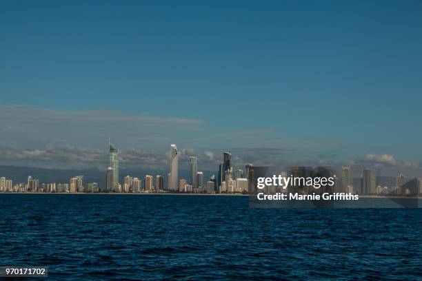 city skyline looking back from the ocean - gold coast skyline stock pictures, royalty-free photos & images