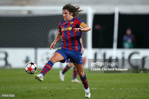 Carles Puyol of Barcelona runs with the ball during the UEFA Champions League round of sixteen, first leg match between VfB Stuttgart and FC...