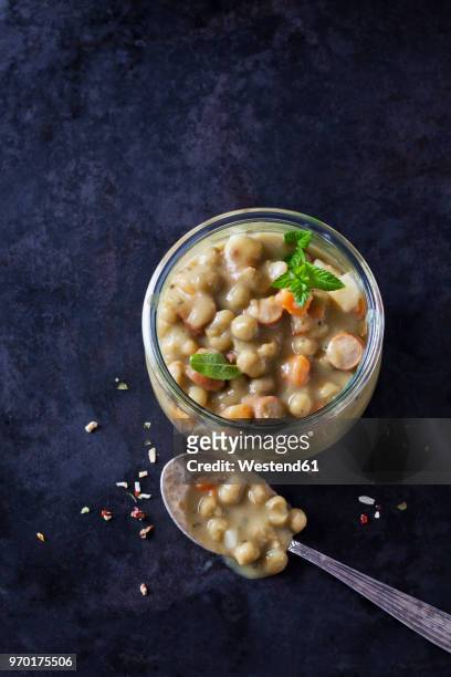 glass of pea stew with sausage - pea and mint soup stock pictures, royalty-free photos & images