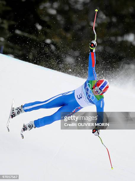 France's David Poisson takes a curve during the Men's Vancouver 2010 Winter Olympics Downhill event at Whistler Creek side Alpine skiing venue on...