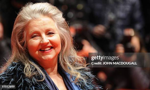 German actress Hanna Schygulla poses for photographers on the red carpet for the awards ceremony of the 60th Berlinale Film Festival in Berlin...