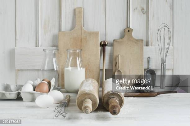 kitchen utensils, rolling pin, wire whisk, shovel, chopping board, eggs, flour and milk - chopping block flour stock pictures, royalty-free photos & images