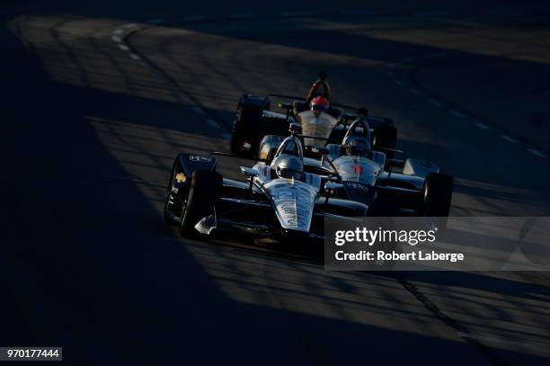 Simon Pagenaud, driver of the DXC Technology Team Penske Chevrolet, leads Josef Newgarden, driver of the Verizon Team Penske Chevrolet, and James...