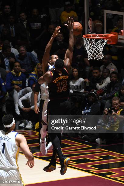 Tristan Thompson of the Cleveland Cavaliers blocks a shot against Andre Iguodala of the Golden State Warriors during Game Four of the 2018 NBA Finals...