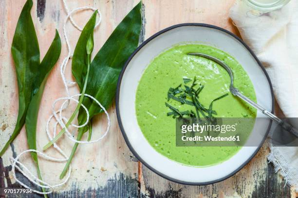 bowl of ramson soup garnished with ramson - cream soup stock pictures, royalty-free photos & images