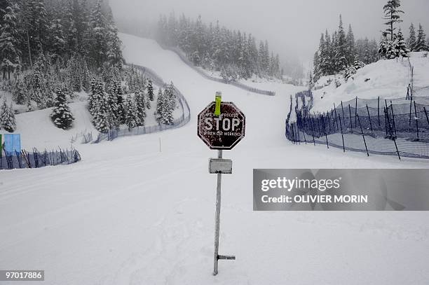 Stop sign is seen on the slope as the Alpine skiing competitions are postponed due to weather conditions at the Whistler Creekside Alpine skiing...