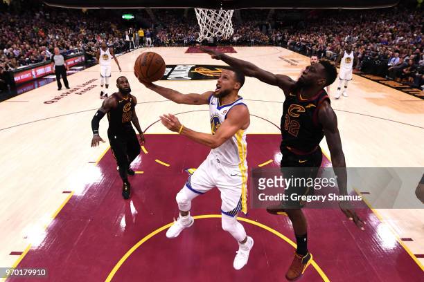 Stephen Curry of the Golden State Warriors drives to the basket against Jeff Green of the Cleveland Cavaliers in the second half during Game Four of...