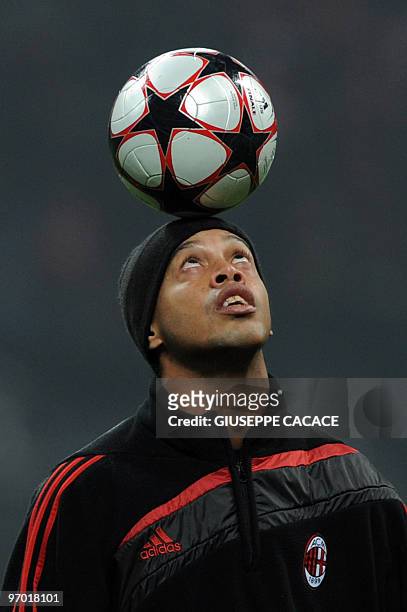 Milan's Brasilian forward Ronaldinho controls the ball prior his team's UEFA Champions League round of 16 match against Manchester United on February...