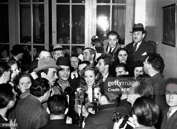 French actress Danielle Darrieux is welcomed by a crowd to fans at her return from Hollywood in 1938 at Saint-Lazare station in Paris.