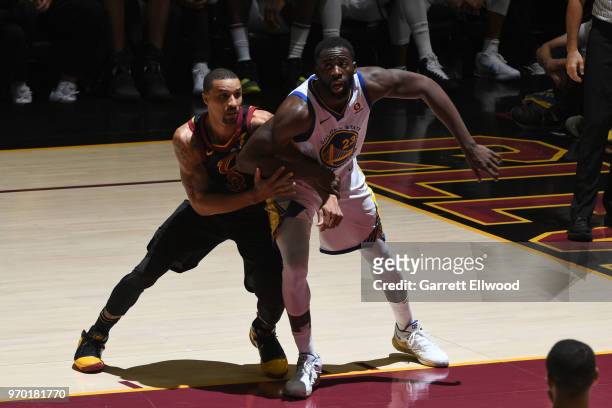 Draymond Green of the Golden State Warriors fights for position against George Hill of the Cleveland Cavaliers during Game Four of the 2018 NBA...
