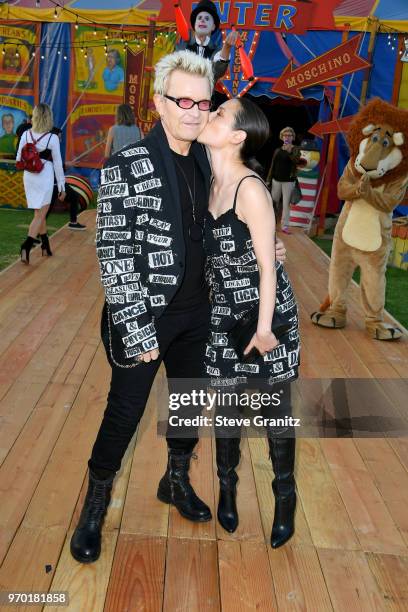 Billy Idol and China Chow attend the Moschino Spring/Summer 19 Menswear And Women's Resort Collection at Los Angeles Equestrian Center on June 8,...