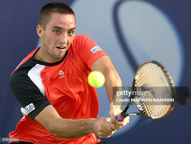 Serbia's Viktor Troicki returns to his compatriot Novak Djokovic during their match in the second round of the ATP Dubai Open tennis championship in...