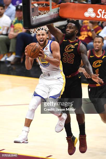 Stephen Curry of the Golden State Warriors drives to the basket against Jeff Green of the Cleveland Cavaliers in the second half during Game Four of...
