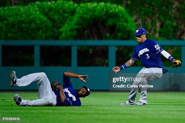 Lorenzo Cain of the Milwaukee Brewers backs up teammate Orlando Arcia by catching the out during the eighth inning against the Philadelphia Phillies...