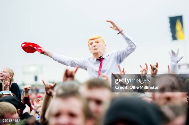 Donald Trump impersonator in the crowd watches on as Andrew W K performs onstage at Download Festival 2018 at Donington Park on June 8, 2018 in...