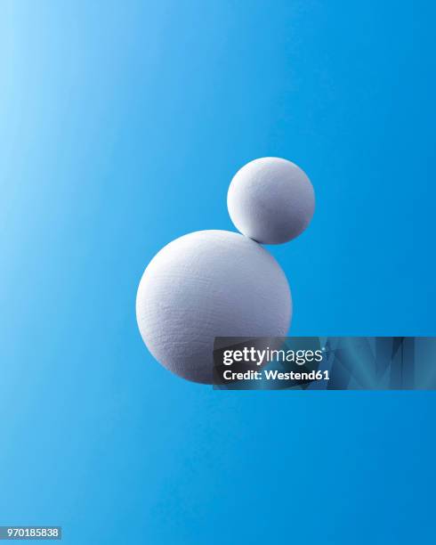 two white spheres in front of blue background - hovering stock illustrations