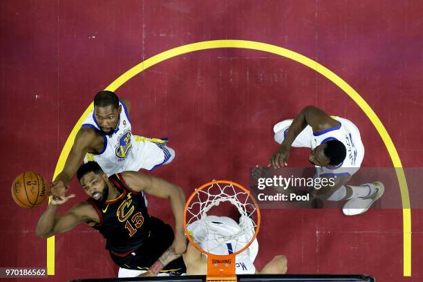 Kevin Durant of the Golden State Warriors fights for a rebound with Tristan Thompson of the Cleveland Cavaliers during Game Four of the 2018 NBA...