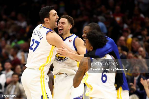 Zaza Pachulia and Andre Iguodala of the Golden State Warriors celebrate after defeating the Cleveland Cavaliers during Game Four of the 2018 NBA...