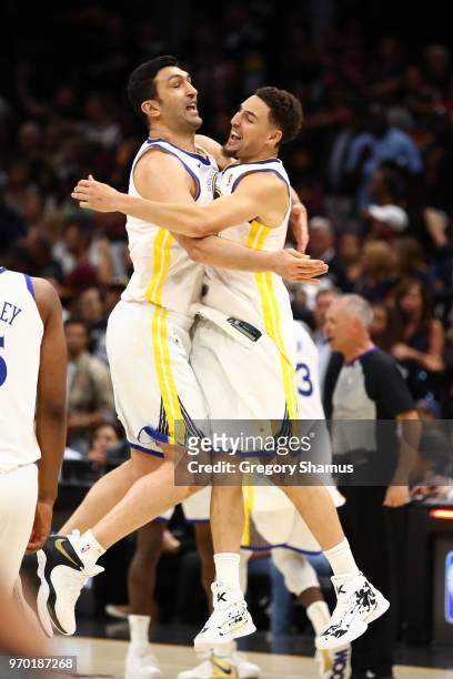 Zaza Pachulia and Andre Iguodala of the Golden State Warriors celebrate after defeating the Cleveland Cavaliers during Game Four of the 2018 NBA...