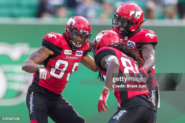 Kamar Jorden of the Calgary Stampeders celebrates with teammates after scoring a touchdown in the first half of the preseason game between the...