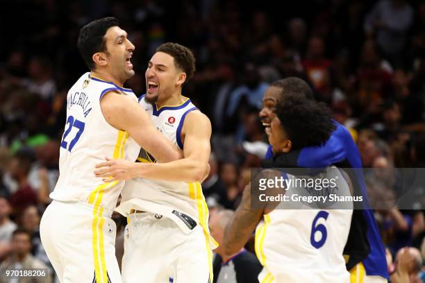 Zaza Pachulia and Andre Iguodala of the Golden State Warriors celebrate after defeating the Cleveland Cavaliers during Game Four of the 2018 NBA...