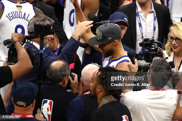Stephen Curry of the Golden State Warriors celebrates after defeating the Cleveland Cavaliers during Game Four of the 2018 NBA Finals at Quicken...