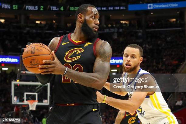 LeBron James of the Cleveland Cavaliers defended by Stephen Curry of the Golden State Warriors during Game Four of the 2018 NBA Finals at Quicken...