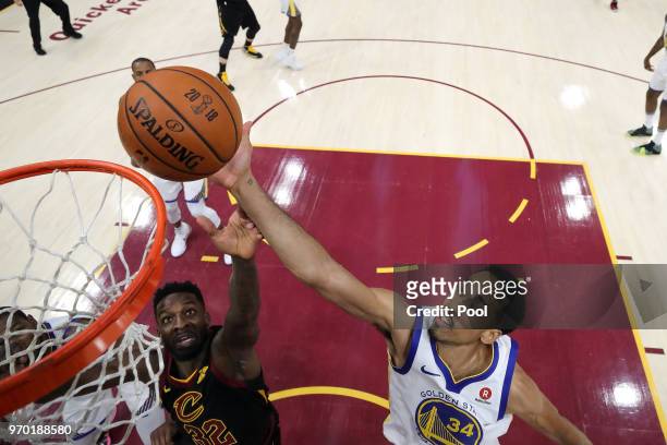 Jeff Green of the Cleveland Cavaliers and Shaun Livingston of the Golden State Warriors fight for a rebound during Game Four of the 2018 NBA Finals...