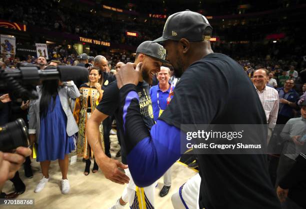 Kevin Durant and Stephen Curry of the Golden State Warriors celebrate after defeating the Cleveland Cavaliers during Game Four of the 2018 NBA Finals...