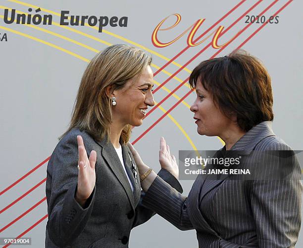 Spain's Minister of Defence Carme Chacon speaks with Lituania's Minister of Defense Rasa Jukneviciene before the first plenary session of the...