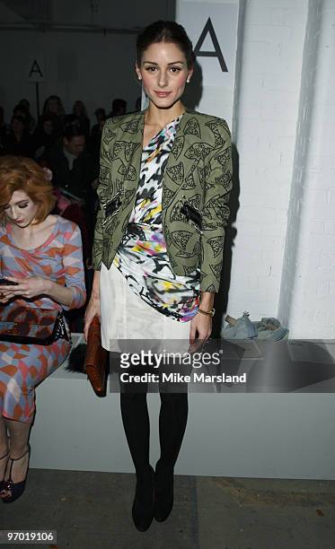 Olivia Palermo poses on the front row at the Unique show for London Fashion Week Autumn/Winter 2010 at TopShop Venue on February 20, 2010 in London,...