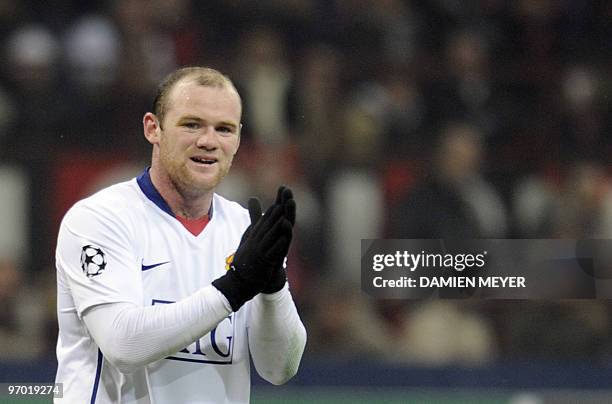 Manchester United's Wayne Rooney applauses during his team's UEFA Champions League round of 16 match against AC Milan on February 16, 2010 at San...