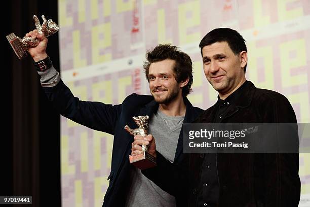 Actor Grigory Dobrygin and actor Sergei Puskepalis pose with the Silver Bear for Best Actor of 'Kak ya provel etim letom' at the 'Award Winners'...