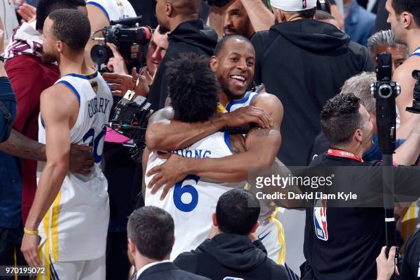 Andre Iguodala hugs Nick Young of the Golden State Warriors as they celebrate a victory over the Cleveland Cavaliers in Game Four of the 2018 NBA...
