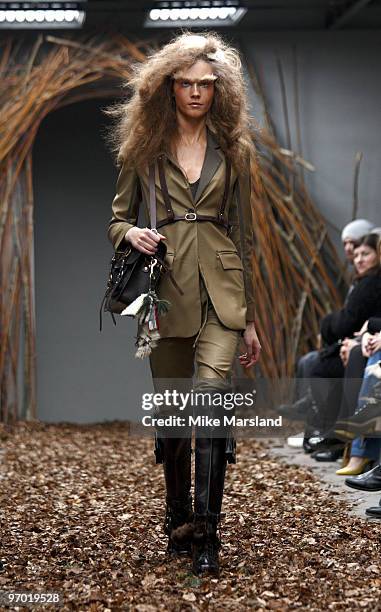 Model walks the runway at the Unique show for London Fashion Week Autumn/Winter 2010 at TopShop Venue on February 20, 2010 in London, England.