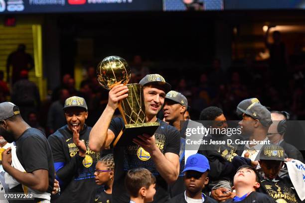 Zaza Pachulia of the Golden State Warriors holds the Larry O'Brien Championship trophy after defeating the Cleveland Cavaliers in Game Four of the...