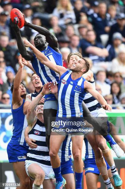 Majak Daw of the Kangaroos marks during the round 12 AFL match between the Geelong Cats and the North Melbourne Kangaroos at GMHBA Stadium on June 9,...