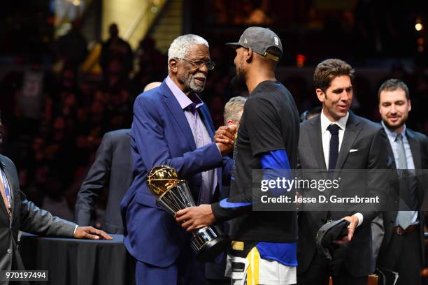 Bill Russell exchanges handshakes with Kevin Durant of the Golden State Warriors after Durant received the Bill Russell Finals MBP Trophy by...