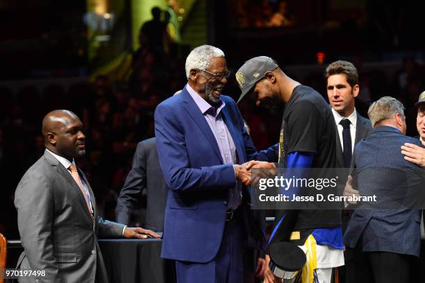 Bill Russell exchanges handshakes with Kevin Durant of the Golden State Warriors after Durant received the Bill Russell Finals MBP Trophy by...