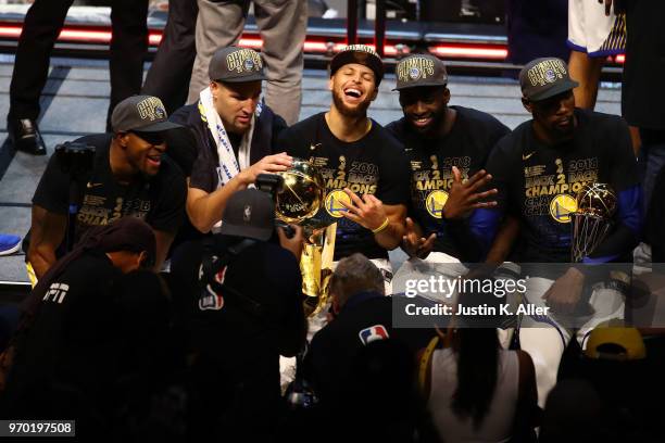Andre Iguodala, Klay Thompson, Stephen Curry, Draymond Green and Kevin Durant of the Golden State Warriors celebrate after defeating the Cleveland...