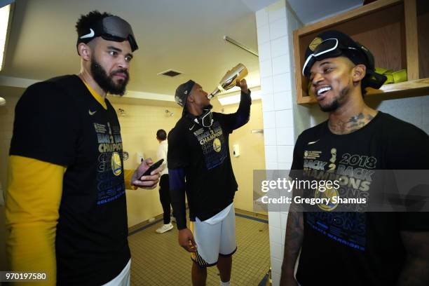 JaVale McGee, David West and Nick Young of the Golden State Warriors celebrate in the locker room after defeating the Cleveland Cavaliers during Game...