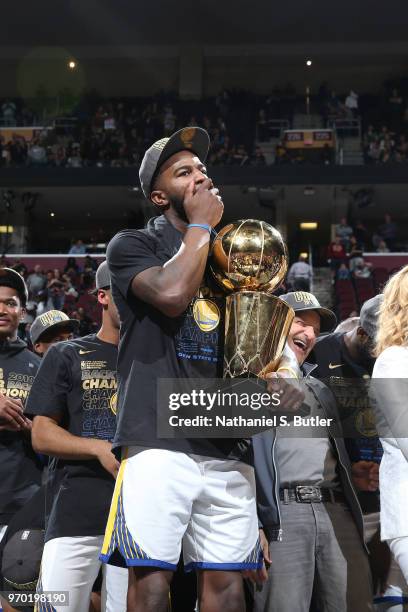 Jordan Bell of the Golden State Warriors holds the Larry O'Brien Championship Trophy after Game Four of the 2018 NBA Finals against the Cleveland...