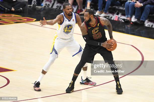 LeBron James of the Cleveland Cavaliers defended by Kevin Durant of the Golden State Warriors during Game Four of the 2018 NBA Finals at Quicken...