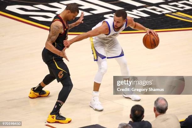 Stephen Curry of the Golden State Warriors defended by George Hill of the Cleveland Cavaliers during Game Four of the 2018 NBA Finals at Quicken...