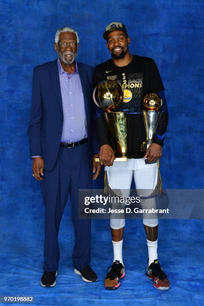 Bill Russell and Kevin Durant of the Golden State Warriors pose for a portrait with the Larry O'Brien Championship trophy and the Bill Russell Finals...