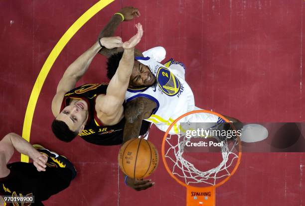 Larry Nance Jr. #22 of the Cleveland Cavaliers and Jordan Bell of the Golden State Warriors compete for the ball in the second half during Game Four...